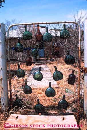 Stock Photo #4101: keywords -  bottle, bottles decoration gate glass into junk landscape material primitive recycle recycled recycling resource reuse rustic vert wine