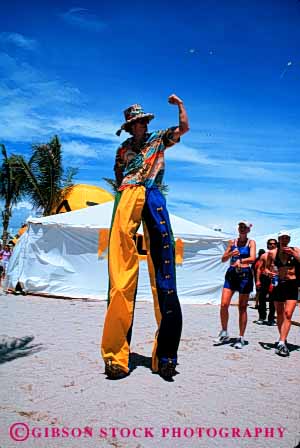 Stock Photo #6175: keywords -  assist big feet help legs lift long man pretend stilts tall unusual vert walk