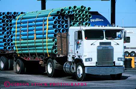 Stock Photo #4109: keywords -  heavy horz industry load parallel pipe transport transportation truck turquoise water