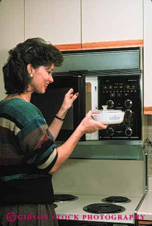 Stock Photo #4113: keywords - appliance cook cooking food home kitchen microwave prepare process released vert woman