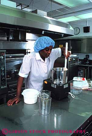 Stock Photo #4115: keywords -  african american appliance black cook cooking employee food hospital institution job kitchen labor metal occupation prepare process profession released service stainless steel stir vert woman