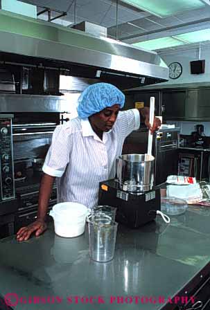 Stock Photo #4115: keywords - african american appliance black cook cooking employee food hospital institution job kitchen labor metal occupation prepare process profession released service stainless steel stir vert woman
