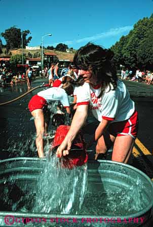 Stock Photo #4140: keywords -  annual bencia bucket california competition contest cooperate event firemens muster perform public race street summer team vert water woman women