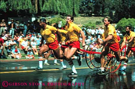 Stock Photo #4141: keywords -  annual bencia blur california cart competition contest cooperate event firemens horz hose men motion movement muster perform public pull race street summer team uniform