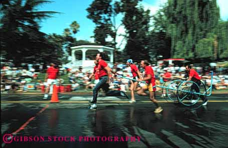 Stock Photo #4142: keywords -  annual bencia blur california cart competition contest cooperate event firemens horz hose men motion movement muster perform public pull race street summer team