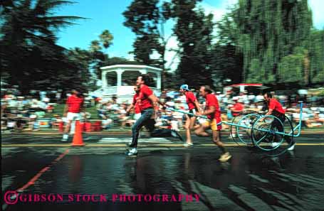 Stock Photo #4142: keywords -  annual bencia blur california cart competition contest cooperate event firemens horz hose men motion movement muster perform public pull race street summer team