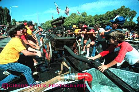 Stock Photo #4143: keywords -  annual bencia boy california competition contest cooperate event firemens hand horz men muster perform public pump race street summer team