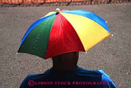 Stock Photo #4147: keywords -  clothing color colorful cover hat head horz shade style umbrella