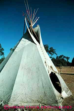 Stock Photo #4158: keywords - american canvas cone geometric geometry historic home house indian native plains pole poles portable primitive pyramid replica replicas residence shelter shelters teepee teepees tent tepee tepees tipi tipis tradition triangle vert west
