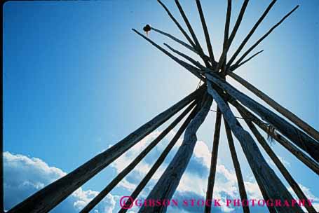 Stock Photo #4159: keywords -  american cone geometric geometry historic home horz house indian native poles portable primitive pyramid residence shelter silhouette sun teepee tent tradition triangle west wood