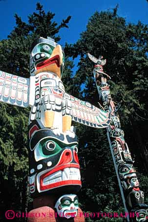 Stock Photo #4174: keywords -  american canada carve craft decorate indian native paint park poles stanley symbol totem vancouver vert wood worship