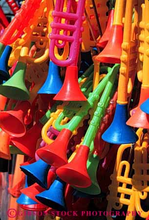 Stock Photo #4182: keywords -  band colorful create equipment fair hand horns instrument music musical noise note perform plastic practice prize show sound tool toy vert