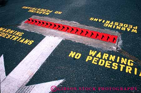 Stock Photo #4199: keywords -  arrow car caution gate horz lot one park parking puncture restrainer teeth tire warning way