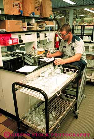 Stock Photo #4214: keywords - chemistry clean employee equipment filter industry job laboratory machine monitor occupation plant process public quality record released sanitation science sewage skill technician test treatment utility vert waste water