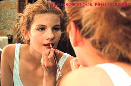 Stock Photo #4230: keywords -  appearance apply beauty cosmetic esteem home horz looks make mirror preparation reflection released self smile teenage teenager up woman young