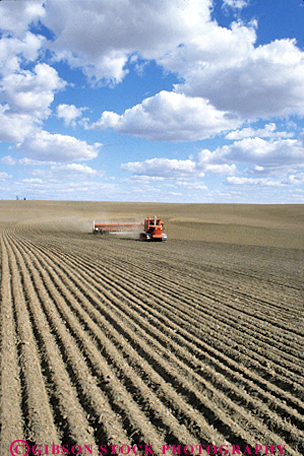 Stock Photo #3316: keywords -  agriculture davenport dirt empty equipment field fields furrow furrows horizon implement in landscape large machine open plow plowing plows row scenery scenic soil till tractor tractors vert washington work working works