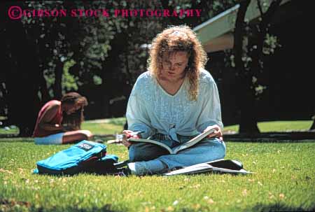 Stock Photo #4261: keywords - adult blond campus college concentrate educate education focus girl homework horz lawn learn outdoor quiet read relax released remember school student study summer teenage woman