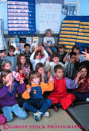 Stock Photo #4271: keywords -  adolescent boy boys child children class classroom communicate communications educate education elementary girl girls grade group hand kid kids language learn school second sign students study symbol together vert young youth