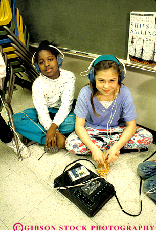 Stock Photo #4273: keywords - adolescent african american black child children class classroom educate education elementary ethnic forth fourth girl girls grade group kid kids learn listen minority mix mixed music pair race released school students study together two vert young youth