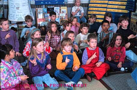 Stock Photo #4287: keywords -  adolescent boy boys child children class classroom communicate communications educate education elementary girl girls grade group hand horz kid kids language learn school second sign students study symbol together young youth