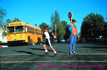 Stock Photo #4297: keywords -  adolescent adult boy child children control crossing direction educate education elementary guard horz learn protect released safety school sign teacher traffic uniform woman young youth