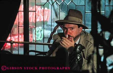 Stock Photo #4305: keywords -  actor as bar character cigarette crime detective drama eye eyes hat horz investigate investigation observe released sam smoke smoking spade suspicious undercover watch watching