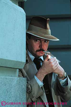 Stock Photo #4306: keywords -  actor as bar character cigarette crime detective drama eye eyes hat investigate investigation observe released sam smoke smoking spade suspicious undercover vert watch watching