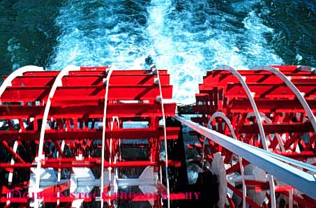 Stock Photo #4347: keywords -  action boat boating churn churned churning churns color craft float horz motion paddle pedal propel propulsion push recreation red rotate rotates rotating rotation round splash vessel wake water wheel