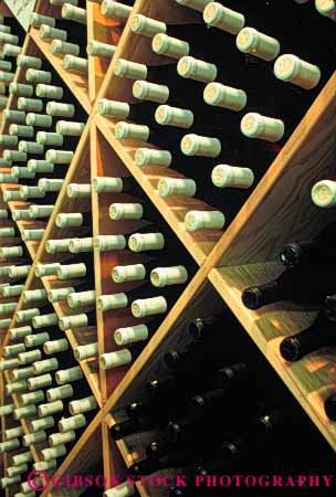 Stock Photo #4360: keywords - alcohol bottle bottles clear container cylinder display drink glass pattern rack round row storage symmetrical symmetry vert wine