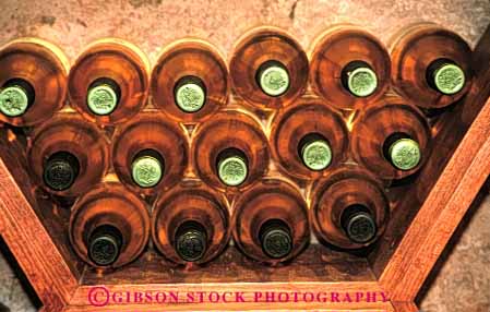 Stock Photo #4362: keywords -  alcohol bottle bottles brown clear container cylinder display drink glass horz pattern rack round row storage symmetrical symmetry tan wine