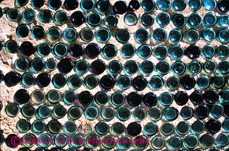 Stock Photo #4364: keywords -  bottle bottles container cylinder glass horz made old pattern repeat repetition round row symmetrical symmetry wall with