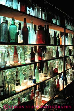 Stock Photo #4365: keywords -  antique bottle bottles collectors container display glass historic item jerome old pattern row sale sales sell translucent transparent vert vintage window