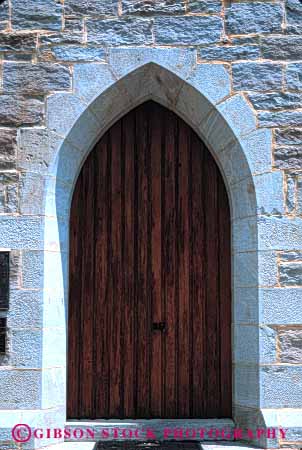 Stock Photo #4379: keywords -  arch architecture church custom design door doorway entrance entry frame front keystone pattern stone vert wall wood