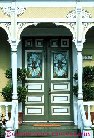 Stock Photo #4380: keywords -  arch architecture custom decorate decorated design door doorway entrance entry fancy frame front gingerbread green home house ornate pattern tradition traditional trim vert victorian vintage wood