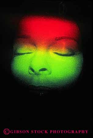 Stock Photo #4409: keywords - abstract artificial color dimension dimensional eye eyes face fake female head hologram human illusion image light science technology three unreal vert woman