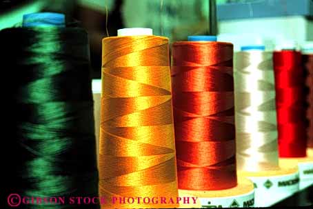 Stock Photo #4414: keywords -  color colorful commercial cone create fabric feeder horz machine manufacture manufactured manufacturing rotate round row sew sewing spools string supply thread