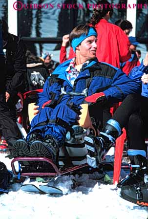 Stock Photo #4431: keywords - challenge challenged disability disabled disadvantage disadvantaged downhill handicap handicapped impair impaired man need needs skier snow special vert wheelchair
