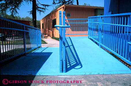 Stock Photo #4434: keywords -  access architecture blue chair challenge challenged design disability disabled disadvantage disadvantaged geometric geometry handicap handicapped horz impair impaired need needs ramp special wheel wheelchair