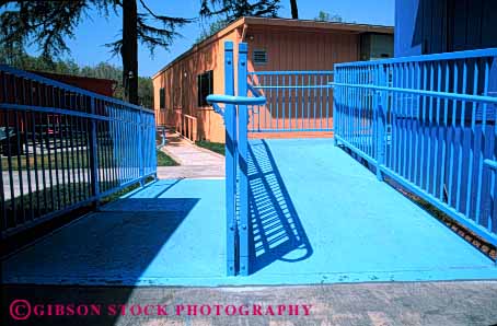 Stock Photo #4434: keywords - access architecture blue chair challenge challenged design disability disabled disadvantage disadvantaged geometric geometry handicap handicapped horz impair impaired need needs ramp special wheel wheelchair