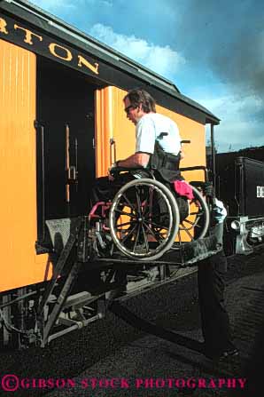 Stock Photo #4436: keywords -  access challenge challenged disability disabled disadvantage disadvantaged handicap handicapped hydraulic impair impaired lift man need needs platform special train vert wheelchair