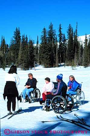 Stock Photo #4437: keywords -  area challenge challenged disability disabled disadvantage disadvantaged group handicap handicapped impair impaired need needs ski snow special vert wheelchair winter