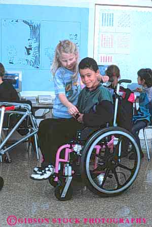 Stock Photo #4438: keywords - boy challenge challenged children class disability disabled disadvantage disadvantaged elementary girl handicap handicapped happy impair impaired need needs released school share smile special students together vert wheelchair