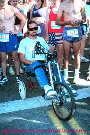 Stock Photo #4440: keywords -  athlete challenge challenged disability disabled disadvantage disadvantaged handicap handicapped impair impaired man race racer sport vert wheelchair