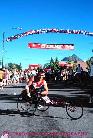 Stock Photo #4441: keywords -  athlete chair challenge challenged disability disabled disadvantage disadvantaged handicap handicapped impair impaired man need needs race racer released special sport vert wheel wheelchair