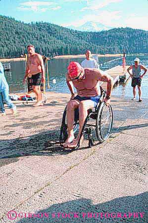 Stock Photo #4451: keywords -  athlete challenge challenged disability disabled disadvantage disadvantaged effort handicap handicapped impair impaired man need needs race racer special sport swim triathelon vert wheelchair work