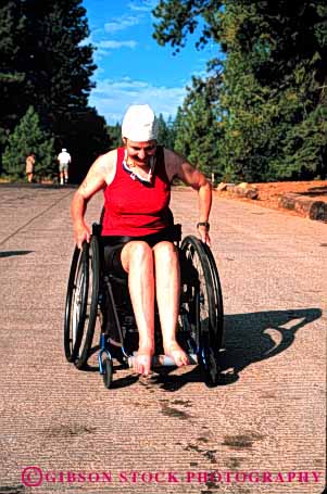 Stock Photo #4452: keywords - athlete challenge challenged disability disabled disadvantage disadvantaged effort handicap handicapped impair impaired need needs race racer special sport triathelon vert wheelchair woman work