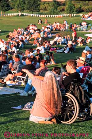 Stock Photo #4453: keywords - access challenge challenged concert crowd disability disabled disadvantage disadvantaged handicap handicapped impair impaired man need needs outdoor special summer vert wheelchair