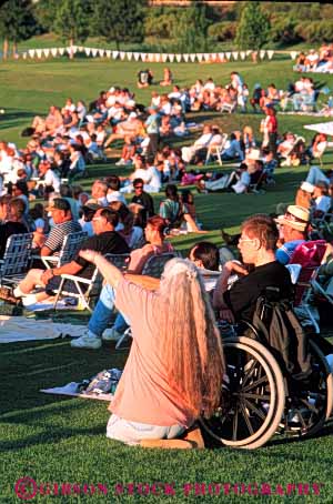 Stock Photo #4453: keywords -  access challenge challenged concert crowd disability disabled disadvantage disadvantaged handicap handicapped impair impaired man need needs outdoor special summer vert wheelchair