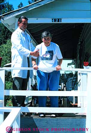 Stock Photo #4455: keywords - assist assisted assists attendant attendants care challenge challenged client clients disability disabled disadvantage disadvantaged giver handicap handicapped health healthcare help home house impair impaired need needs released special vert wheelchair woman