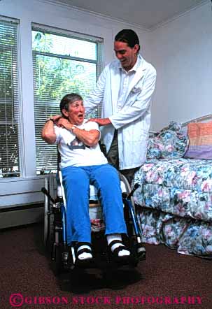 Stock Photo #4456: keywords -  assist assisted assists attendant attendants care challenge challenged client clients disability disabled disadvantage disadvantaged giver handicap handicapped health healthcare help home house impair impaired need needs released special vert wheelchair woman